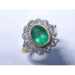 A Columbian emerald and diamond cluster ring