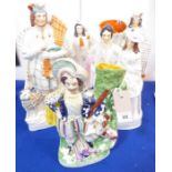 Five 19th century hand-decorated Staffordshire figures; the largest a Scotsman with bagpipes (