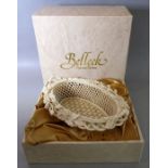 A Belleek Parian China basket-weave oval basket; printed mark to underside, in its original box (