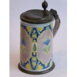 An 18th/19th century Continental pottery and pewter mounted tankard of large proportions; three