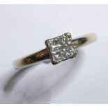 An 18-carat white-gold dress ring set with four diamonds in a square design, ring size N (total