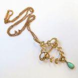 An Edwardian half pearl and yellow gold openwork pendant/brooch of scroll and foliate design,