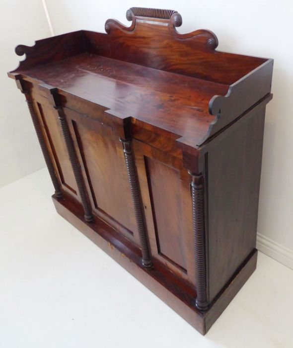 A late Regency period mahogany chiffonier; the three-quarter galleried top above three figured