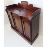 A late Regency period mahogany chiffonier; the three-quarter galleried top above three figured