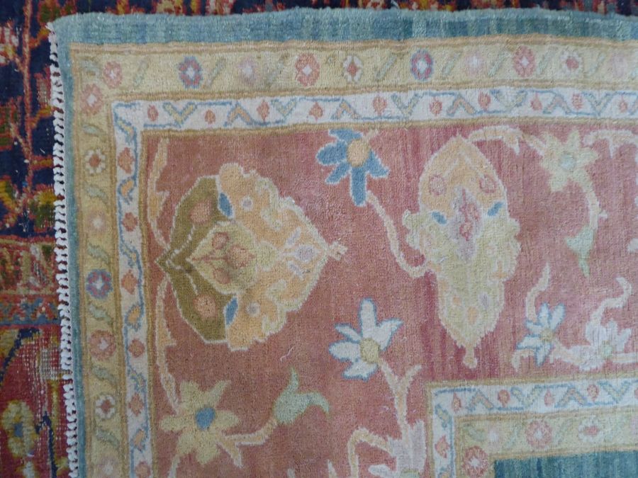 A modern hand-knotted Afghan K.K.Super Zeigler carpet with salmon and green ground (refugee - Image 5 of 6