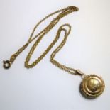A 9-carat yellow-gold circular pendant locket upon a 9-carat gold chain (within black velvet