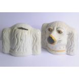 A pair of 19th century Staffordshire pottery money boxes modelled as spaniel's heads (12cm wide x