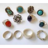 Twelve silver (and other) rings; some in the Modernist style and some set with precious stones. (