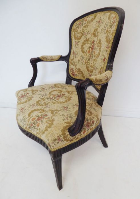 A late 18th century mahogany and upholstered open armchair in the style of John Linnell; the arms