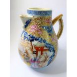 An 18th century Chinese porcelain 'sparrow beak' jug; the front panel hand decorated with figures