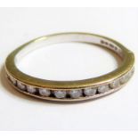 An 18-carat white gold (marked 750) half-eternity ring set with diamonds, ring size K/L (approx. 1.