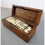 A set of 27 prisoner of war style ebony and bone dominos within an oak case (probably late 19th /