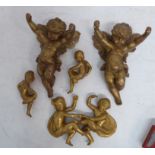 Decorative gilded cherubic-style figures etc., in plaster and wood including two winged cherubic