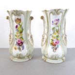 A pair of mid-19th century ceramic vases hand gilded and decorated with floral sprays in enamels (