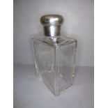 A large 1920s silver-mounted Asprey flask; fine crystal glass with angular, faceted shoulders and