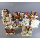 A good selection of 19th century Staffordshire spill vases and models of castles etc. in pastille