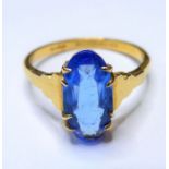 A 22-carat gold ring set with a large blue stone (topaz?) (size O/P)