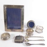 Silverware comprising a rectangular silver photograph frame and a smaller circular example, a