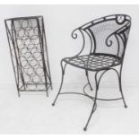 A wrought-iron garden tub chair and a metal and wirework wine rack (2)