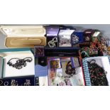 A large quantity of costume jewellery to include rings, necklaces, earrings, brooches and watches