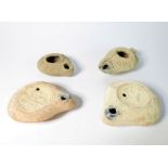 Four 2nd / 3rd century Roman pottery oil lamps