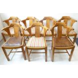 A good set of seven Art Deco period/style light oak dining chairs; the central vertical
