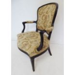 A late 18th century mahogany and upholstered open armchair in the style of John Linnell; the arms