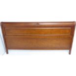 Panelled wooden headboard with central flower-shaped caving to top and two diamond designs to the