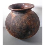 A large ovoid terracotta garden planter