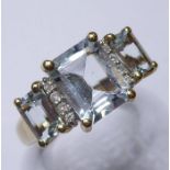 A 9-carat gold aquamarine and diamond ring (size M/N)