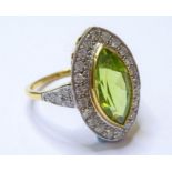 An 18-carat gold marquise peridot and diamond cluster ring (size N)