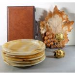 An assortment of items to include six heavy 30cm onyx dining plates, a wooden carving of a maple