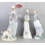 Three large hand-decorated Lladró porcelain figures; the tallest an elegant lady holding an umbrella
