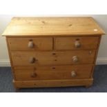 A late 19th century stripped pine chest; the moulded top above two half-width and two full-width