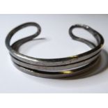 A heavy solid silver C-shaped bangle (boxed)