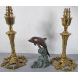 A pair of cast gilt-metal lamps, together with a brass/bronze patinated model of a dolphin