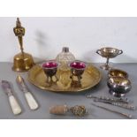 Brassware, silver and silver plate to include an Eastern bell and circular tray, a silver-bladed and