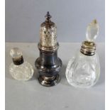 A modern hallmarked silver castor in 18th century style and two cut-glass scent bottles with
