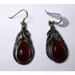 A pair of silver earrings set with pear-shaped polished cabochon hardstones (possibly carnelian) (