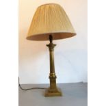 A Laura Ashley brass table lamp modelled as a Corinthian column with acanthus capital, together with