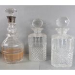 A pair of hand-cut spirit decanters of square section with canted corners, together with a hand-