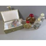 Five Chinese reverse glass painted snuff bottles (one boxed), various topographical subjects and