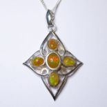 A Celtic-style silver pendant set with four oval polished cabochon hardstones, suspended from a