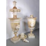 Various constituent parts of a pair of marble/onyx neo-classical-style urns/candlesticks