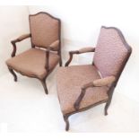 A pair of Louis XV-style (and possibly period?) open armed, stained wood and upholstered fauteuil;