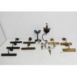 An assortment of wall mounting picture lights, together with a painted novelty ironwork rocking ship