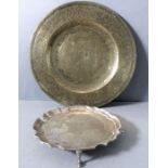A small hallmarked silver Georgian-style (later) salver and a larger engraved circular brass/