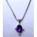 An 18-carat white-gold, amethyst and diamond pendant and chain. (The chain 45.5cm long and the