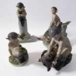 Four mid-20th century Royal Copenhagen porcelain figures (Danish factory): faun seated on fluted