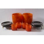 Two large and heavy orange glass candle holders (18cm high), together with four smaller, matching